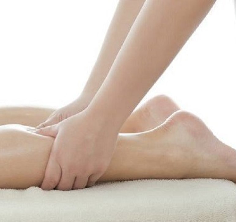 Womans legs beaing massaged